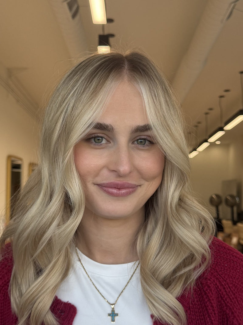 Bright blonde with curtain bangs