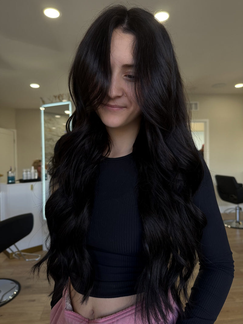 Long, glossy soft-black waves