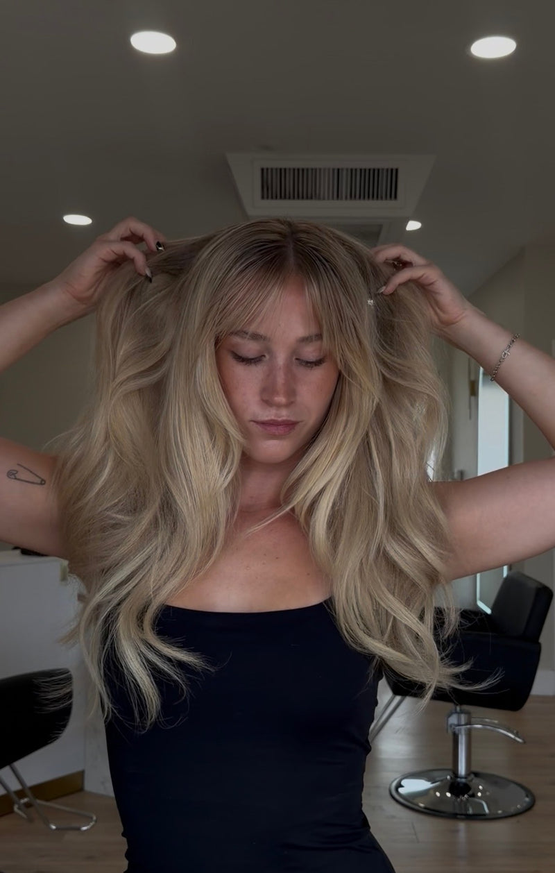 Bright blonde with curtain bangs